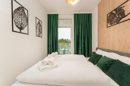 Ένα ή περισσότερα κρεβάτια σε δωμάτιο στο Apartament Eco Modern IV z Basenem Letnim by HolidaySun
