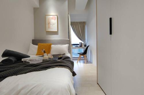 a bedroom with a bed and a desk in it at Pavilion Bukit jalil Walking Distance 2 Bedroom 2-4Pax in Kuala Lumpur