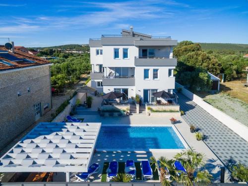 an aerial view of a villa with a swimming pool at Luxury Home Polo in Bibinje