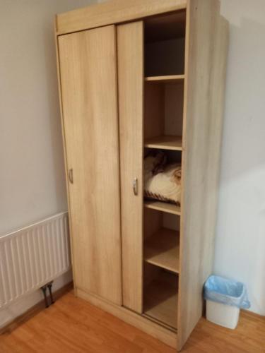 a cupboard in a room with a bed in it at HOSTEL WIEN in Barakovići