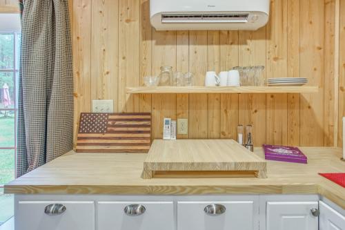 a kitchen with a wooden counter top with an american flag at Tranquil Fairmont Studio with Patios - Pets Welcome! 