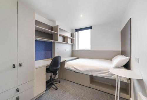 a small bedroom with a bed and a desk at For Students Only Canvas City Point Coventry in Coventry