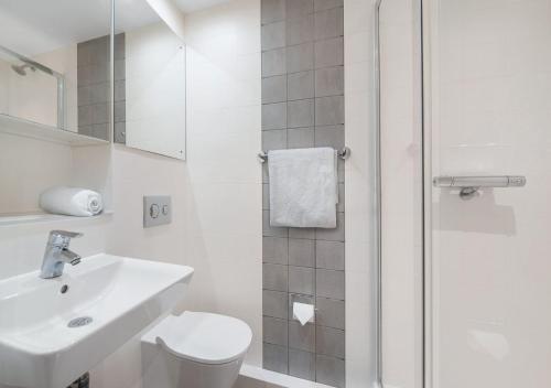 a bathroom with a toilet and a sink and a shower at For Students Only Canvas City Point Coventry in Coventry