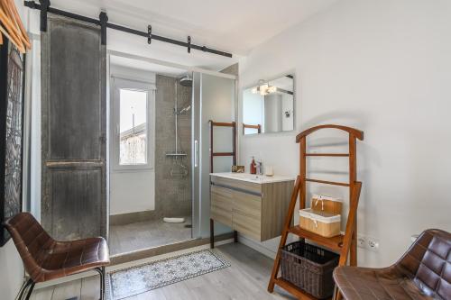 a bathroom with a shower and a sink and a ladder at El Estudio del Astillero in Ayamonte