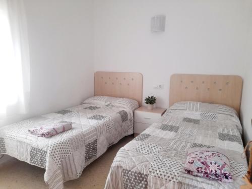 Posteľ alebo postele v izbe v ubytovaní Apartamentos Vista