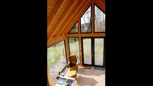 an overhead view of a living room with large windows at Czas i Las Glamping in Sadek