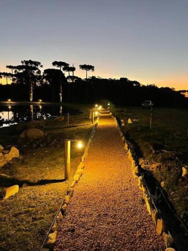 a road with lights on it at night at Cabana Fazenda Santa Inês - São Francisco de Paula in São Francisco de Paula