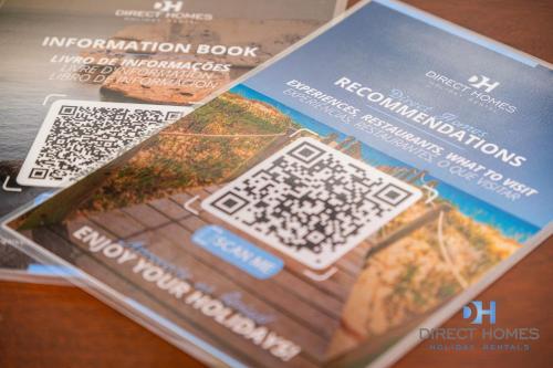 a magazine with an information about a house at Villas Rocha in Albufeira