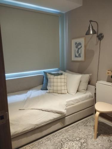 a bed in a room with a window at S Residences in Manila