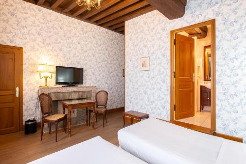 Ένα ή περισσότερα κρεβάτια σε δωμάτιο στο Hotel Belle Epoque