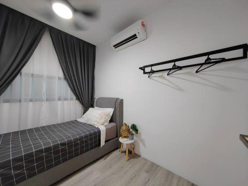 a bedroom with a bed and a window at Lumi Tropicana 3 Bedroom Golf View # 1-6pax in Petaling Jaya