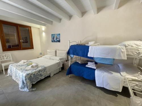 a hospital room with two beds and a table at Case vacanze Spagnola 106 in Marsala