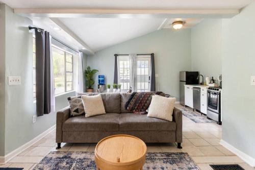 a living room with a couch and a kitchen at Southern Charm Retreat - 1Bedroom in Irmo