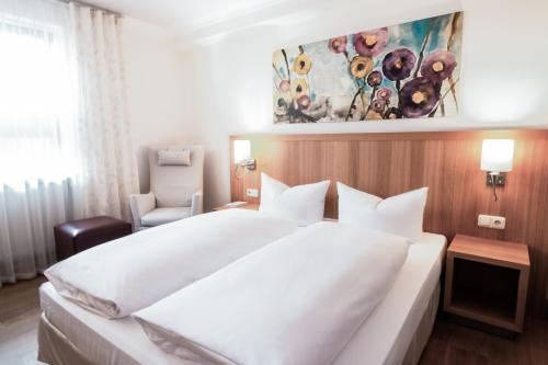 Cama o camas de una habitación en Romantik Hotel Hirschen