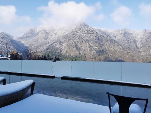 a balcony with a view of a mountain at Avatar Mountain Resort in Zhangjiajie