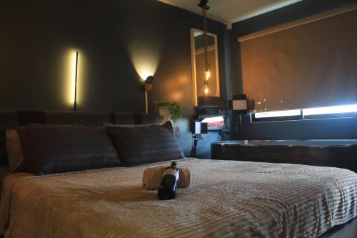 a bedroom with a bed with a clock on it at EL MEIR PRIME CABIN w/ Bathtub near EK in Santa Rosa