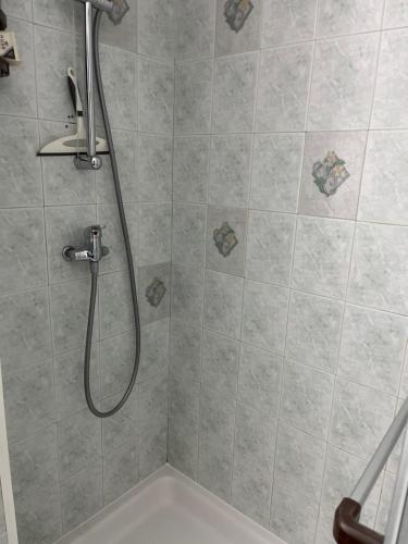 a shower with a shower head in a bathroom at LOCATION CAP D'AGDE in Cap d'Agde