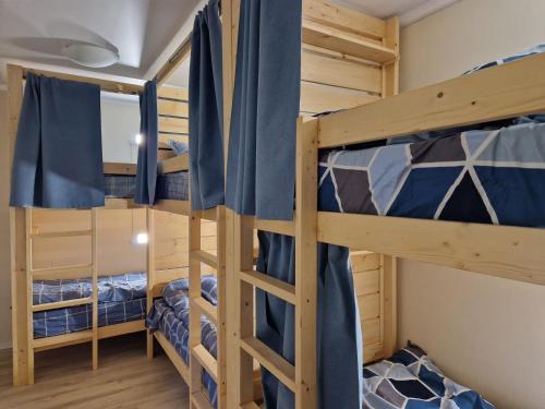 a bedroom with two bunk beds in a cabin at Hostel Buddha in Chişinău