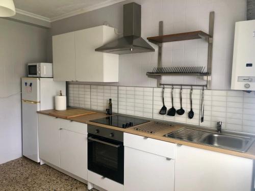 Kuchyň nebo kuchyňský kout v ubytování Vivienda de Uso Turístico Cariño