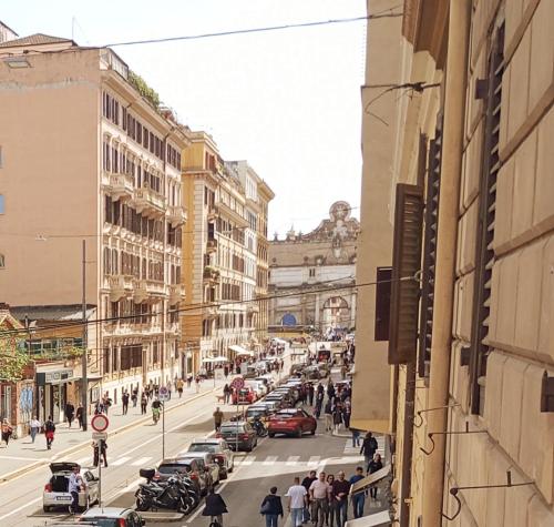 a busy city street with cars and people on the street at Flaminia71 in Rome