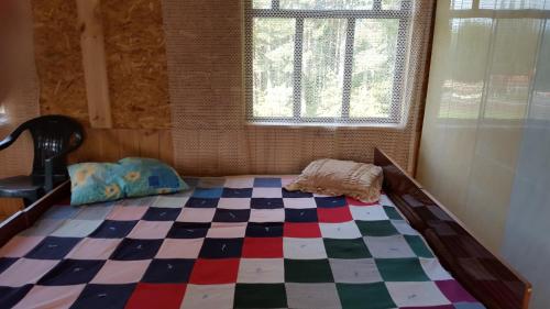 Una cama o camas en una habitación de Priedīši
