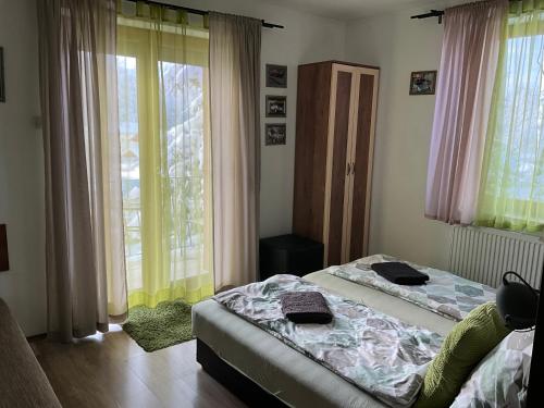 a bedroom with a bed and a window at Silver Bike Motel in Velden am Wörthersee