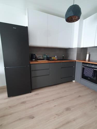 Η κουζίνα ή μικρή κουζίνα στο Apartament Number 2 NOVA WOZOWNIA Free Parking