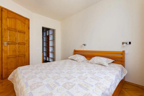 Voodi või voodid majutusasutuse Bíbor Apartment toas