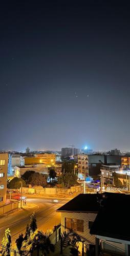 a city at night with a street and buildings at Residence Roume Abidjan Plateau in Abidjan