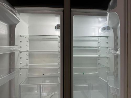 a refrigerator with its door open and its door at Casa Luxury Olta in Sestri Levante