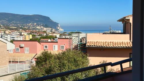 a view of a city with the ocean in the background at Residence Le Palme in Numana