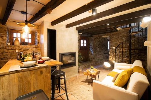 a living room with a white couch and a bar at Casa da Serra - Mountain Home in Arganil