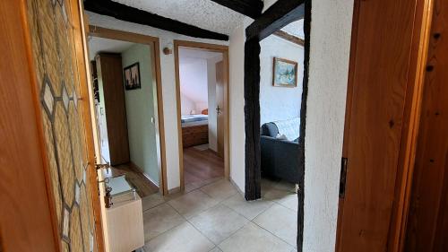 a hallway of a house with a room with a bedroom at Altmarkblick in Erbenhausen