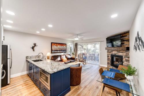 a kitchen and living room with a fireplace at Estes Park Vacation Rental 1 Mi to National Park in Estes Park