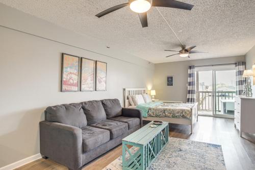 a living room with a couch and a bed at Ocean City Studio - Steps to Boardwalk and Beach! in Ocean City