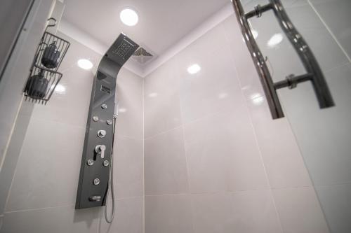a shower in a bathroom with a shower head at Kawsay Apart in La Paz