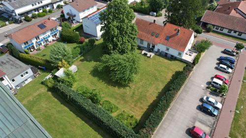 an aerial view of a yard with a large tree at FEWO-ATLANTA Reinhardshausen in Reinhardshausen