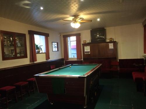 
A pool table at Half Moon Hotel And Restaurant
