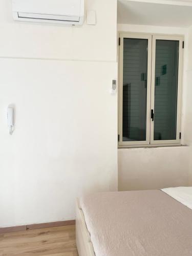 Ένα ή περισσότερα κρεβάτια σε δωμάτιο στο Casa di Magda2