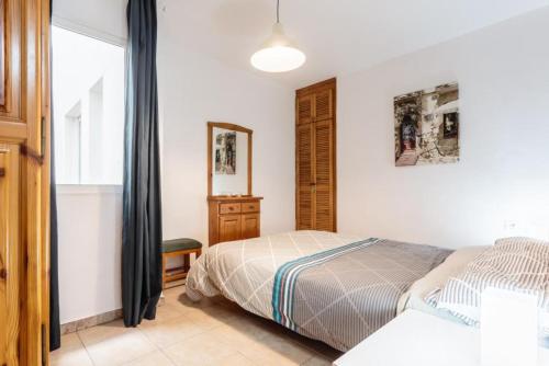 A bed or beds in a room at Apartamento Daniella