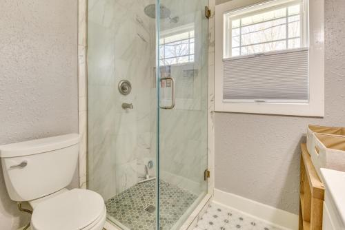 a bathroom with a toilet and a glass shower at Cozy Anna Home Near Southern Illinois Attractions! in Anna