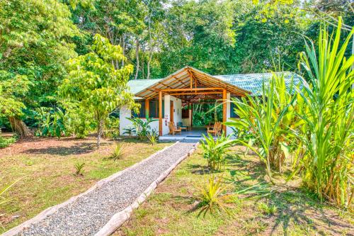 a house in the middle of a garden at Osa Conservation Campus in Cabo Matapalo