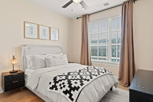 a bedroom with a large bed and a window at Luxurious Urban Retreat with Amazing Amenities in Tampa