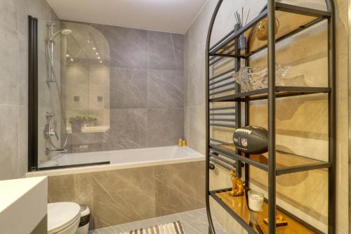 a bathroom with a shower and a toilet at Prestige Views: Luxury Retreat in Bucharest