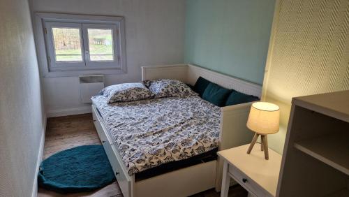 Ένα ή περισσότερα κρεβάτια σε δωμάτιο στο Charmant petit gîte au cœur de la Baie de Somme