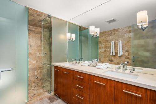 a bathroom with two sinks and a shower at Durant Unit C2, Condo with Designer Finishes, Great Views & Location in Aspen