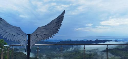 a statue of a bird with its wings spread at Avatar Mountain Resort in Zhangjiajie