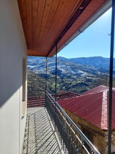 a balcony with a view of a mountain at Studio Giakos in Metsovo