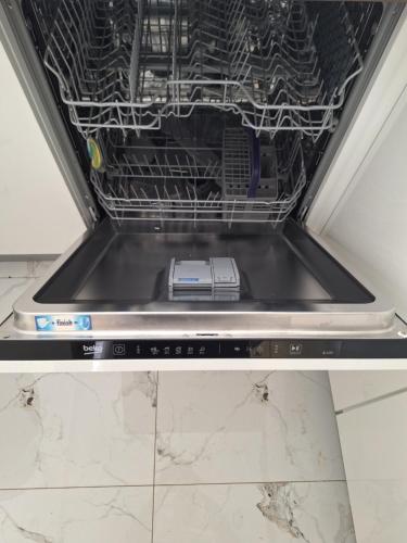 a dishwasher with a laptop inside of it at Pag House in Pag
