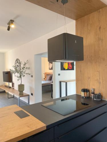 a kitchen with a counter top and a stove top at Valkane Beach Apartments in Pula